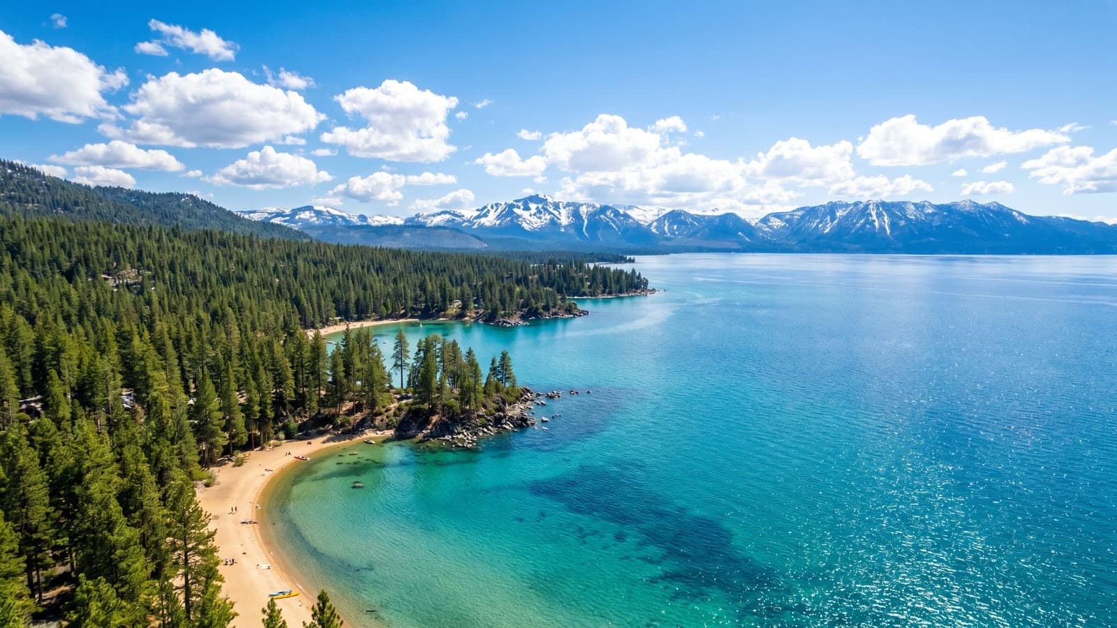 Lake Tahoe Nevada shoreline — deep blue water, Sierra pines, and lakefront homes