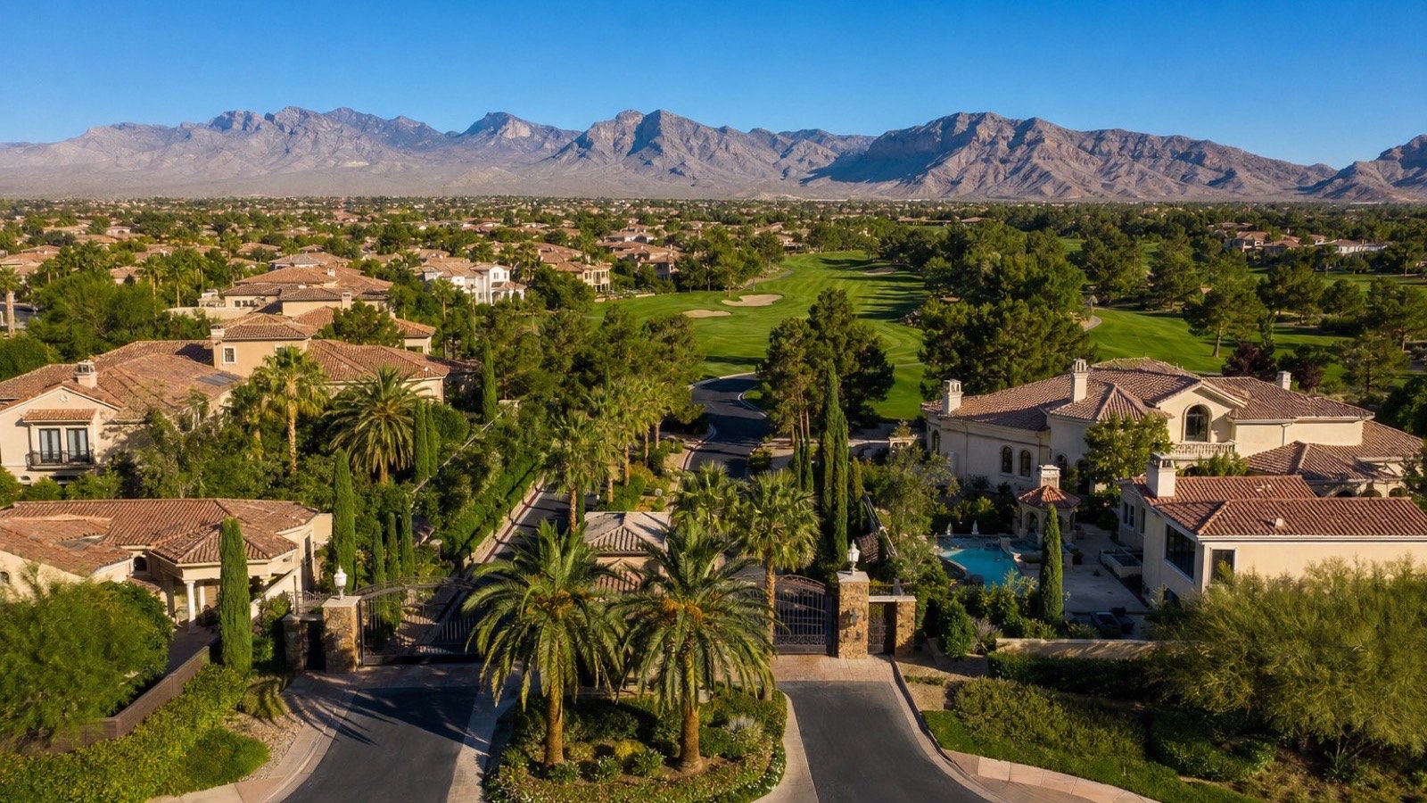 Canyon Gate Country Club Las Vegas Mediterranean luxury estate streetscape with mature palm trees and paver driveways